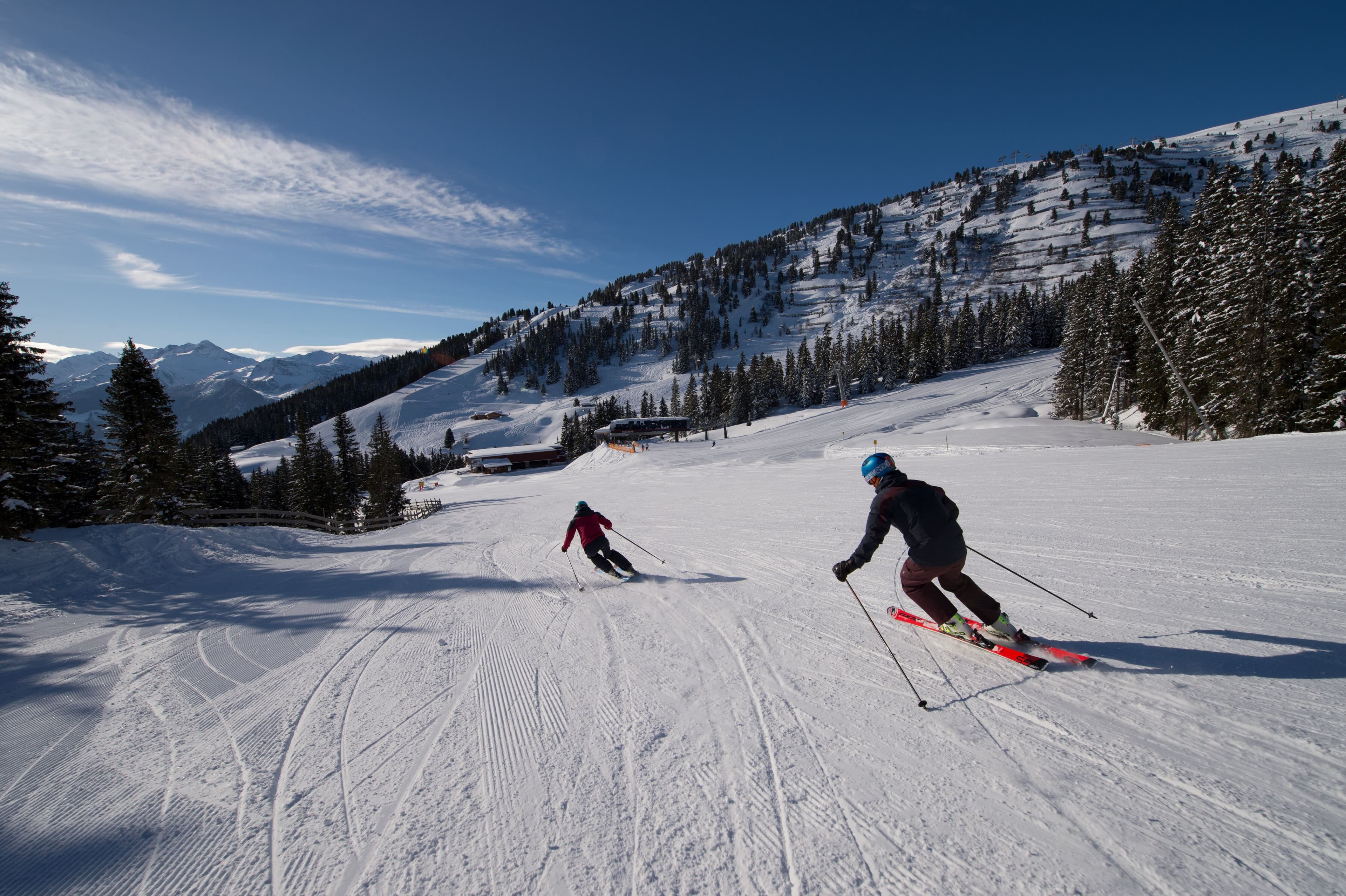 Skiers go down mountain in Oberndorf